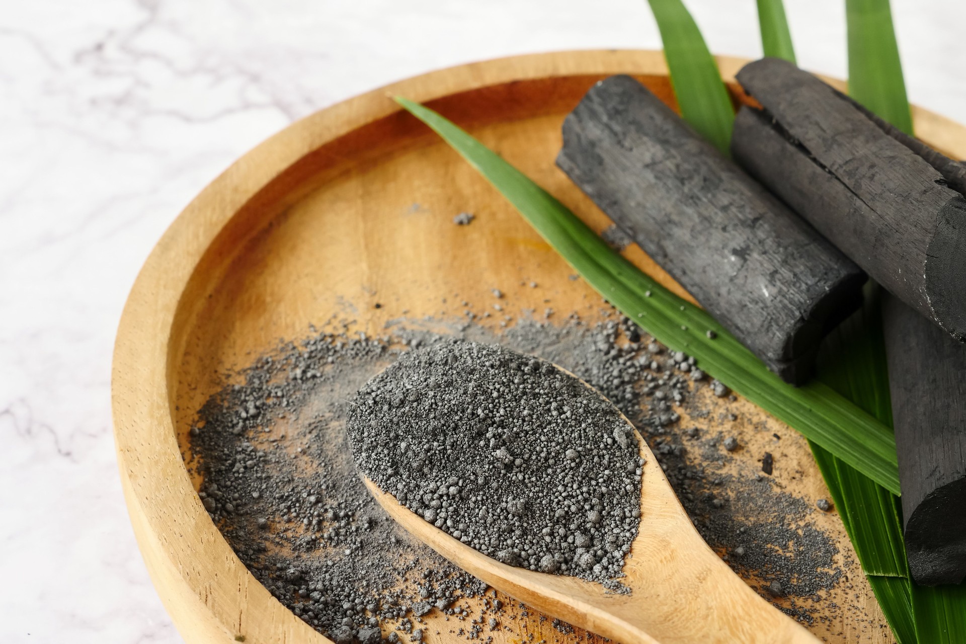 Bamboo charcoal and powder on marble table.